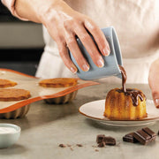 Silpat reusable silicone Tartelette Mold with 12 holes, designed for perfectly shaped pastries and quiches, ideal for enhancing baking precision.