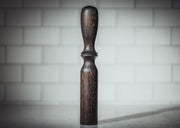 Blanc Creatives cocktail muddler in Noir dark wood finish against white tile background