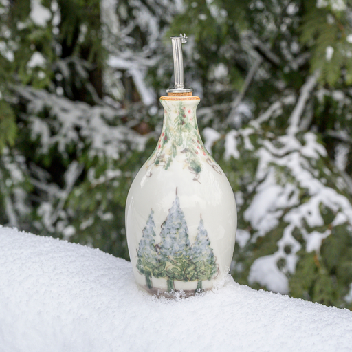 Arte Italica & Crown Linen Designs | Natale Oil Bottle features hand-painted snowy pine trees and garlands, ideal for winter serveware. Perfect for festive displays or gifts.