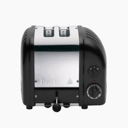 Dualit | 2 Slice Classic Toaster, Matt Black, featuring stainless-steel front, black end caps, two slots, front lever, side browning control knob, and defrost setting.