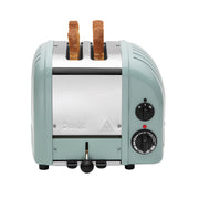 Dualit | 2 Slice Classic Toaster, Eucalyptus, with two slots filled with bread, featuring a browning control knob and lever on the right side.
