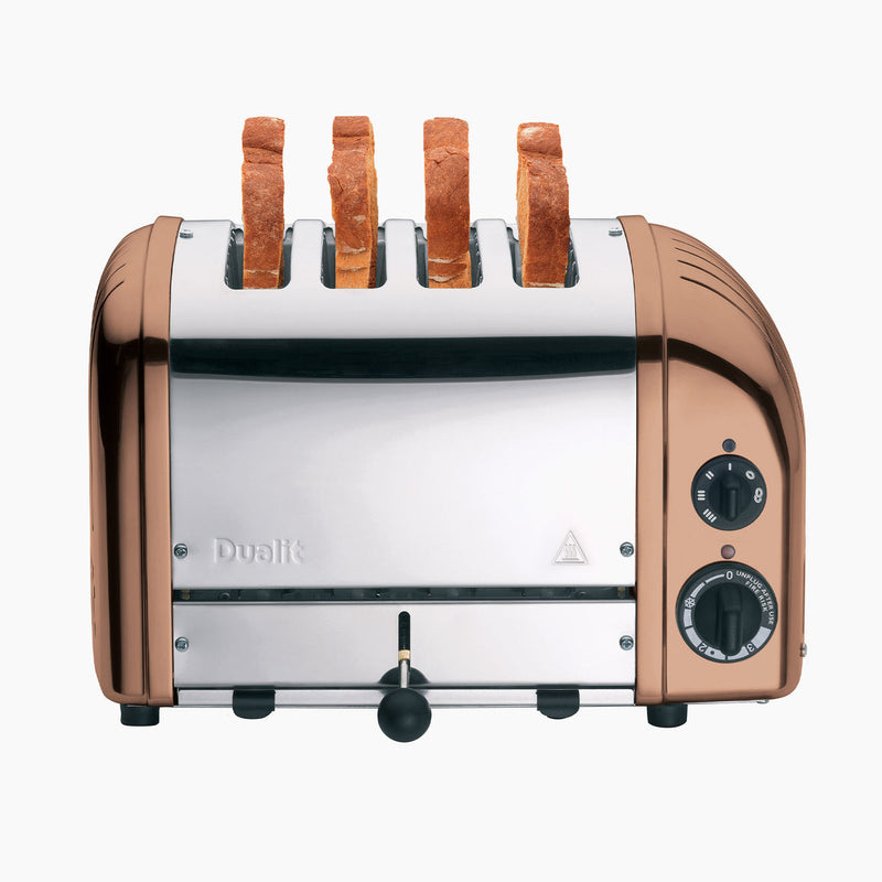 Dualit | 4 Slice Classic Toaster with four upright bread slices, showcasing precision craftsmanship and ProHeat® elements, perfect for efficient toasting and defrosting.