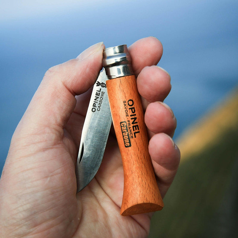 Opinel | No 8 Carbon Steel Folding Knife - Picnic Cutlery+ Set, shown partially open with wooden handle and carbon blade, ideal for versatile outdoor or kitchen use.