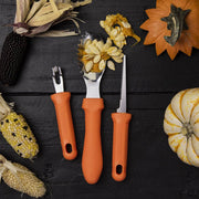 Messermeister | Pumpkin Meister Carving Set on wood surface with Indian corn and pumpkins, featuring three orange-handled tools for precise, professional pumpkin carving.