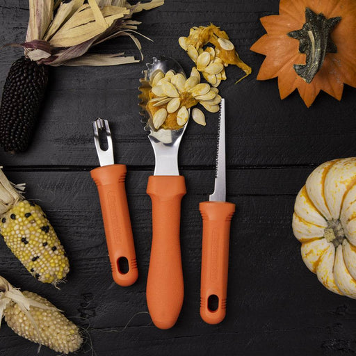 Messermeister | Pumpkin Meister Carving Set on wood surface with Indian corn and pumpkins, featuring three orange-handled tools for precise, professional pumpkin carving.