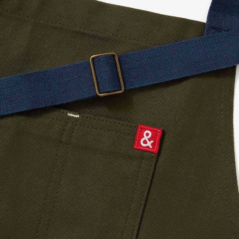Hedley & Bennett | Essential Aprons - Tahoe Pine features adjustable straps and multiple pockets, made from durable cotton canvas for practical kitchen use.