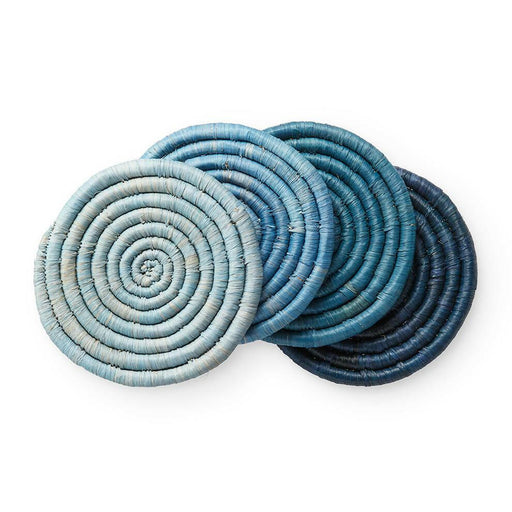 St. Frank | Ombré Coaster Collection - Blue, showcasing blue woven coasters crafted from raffia and banana fibers, tied with a black grosgrain ribbon.