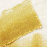 St. Frank | Ombré Linen Collection - Napkins - Ochre, featuring a hand-dyed, ombré linen napkin with a delicate, artistic tear along the edge, showcasing traditional craftsmanship.