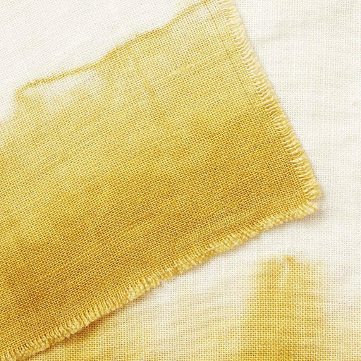 St. Frank | Ombré Linen Collection - Napkins - Ochre, featuring a hand-dyed, ombré linen napkin with a delicate, artistic tear along the edge, showcasing traditional craftsmanship.