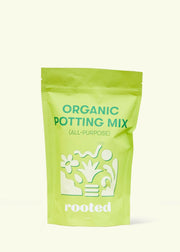 Rooted | Organic Potting Mix - All-Purpose in a green pouch, featuring plant graphics. Contains organic ingredients for optimal nutrient absorption, ideal for tropical houseplants.