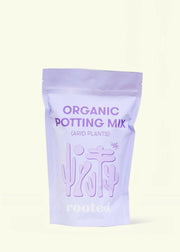 Rooted | Organic Potting Mix - Arid: Stand-up pouch featuring desert plant silhouettes, designed for cacti and succulents with organic compost and nutrient-rich ingredients.