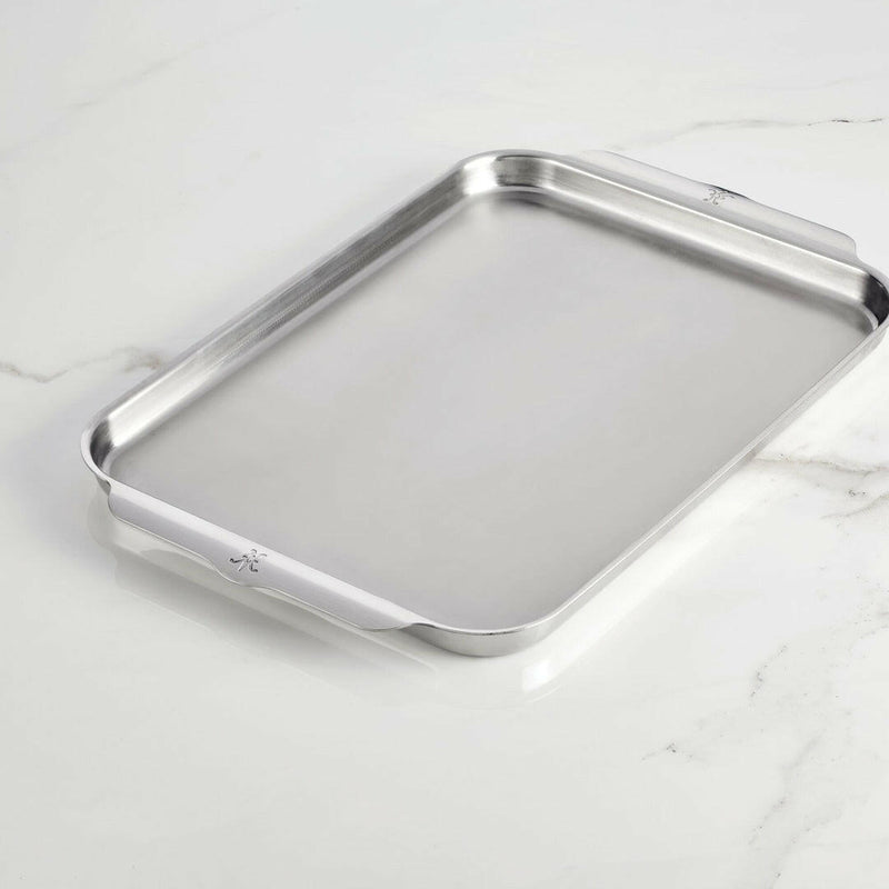 Hestan Provisions | OvenBond Tri-Ply Bakeware - Medium Rack Only, showcasing a durable stainless-steel baking sheet with low sides and curved handles on a light countertop.