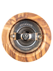 Close-up of the Peugeot Paris Classic Olive Salt Mill's grinding mechanism, showcasing the metal cap with PEUGEOT, FRANCE, and lion logo, set in olive wood.