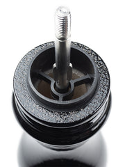 Peugeot | Paris u'Select Pepper Mill, Black Lacquer Wood, 9 inches, showcasing the top metal spindle and grinding burr with stray pepper granules visible.