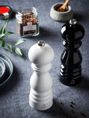 Peugeot | Paris u'Select Pepper Mill, Black Lacquer Wood, 9 inches, displayed with classic spice mills and culinary accessories, embodying elegance and efficiency for kitchen enthusiasts.