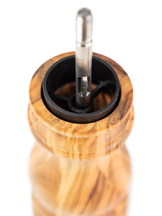 Peugeot | Paris Classic Olive Pepper Mill, Olive Wood, 9 inches, showing its internal grinding mechanism and metal spindle, crafted from sustainably sourced European olive wood.