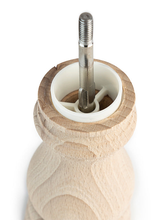 Peugeot | Paris Nature Collection Salt Mill, Nature, features a visible central metal spindle and white plastic bushing in a turned-wood body, emphasizing minimalist elegance.