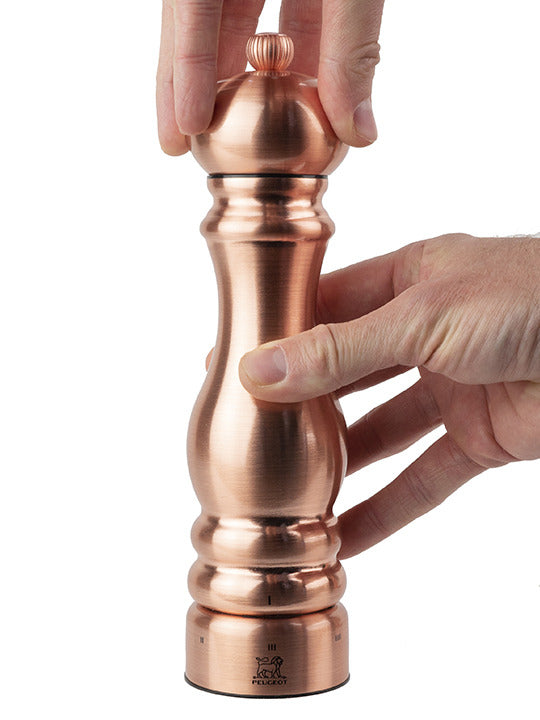 Peugeot | Paris Chef u'Select Pepper Mill, Copper, 9 inches, being refilled, showcasing ergonomic design and adjustable grind settings.