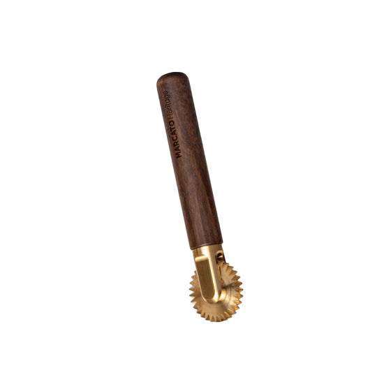Marcato | La Rotella Dentata Cutting Wheel with a wooden handle branded Marcato Heritage and a brass, fluted rotary wheel for cutting or crimping dough edges.