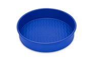 Great Jones | Patty Cake - Broccoli, showcasing its wavy, corrugated stainless-steel design, ideal for effortless baking and easy release of goods.