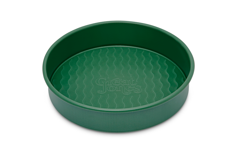 Great Jones | Patty Cake - Broccoli features a wavy, corrugated bottom for easy release, with a durable stainless-steel design ideal for even, golden baking results.
