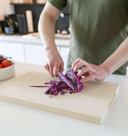 Capabunga | Perfect Prep Cutting Boards - Large, showcased while a person expertly cuts cabbage, highlighting its durable, non-porous surface ideal for professional kitchens.