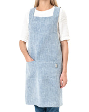 MagicLinen Pinafore Cross-Back Linen Apron in Dusty Blue, L-XL, featuring criss-cross straps and side pockets, ideal for cooking or gardening.