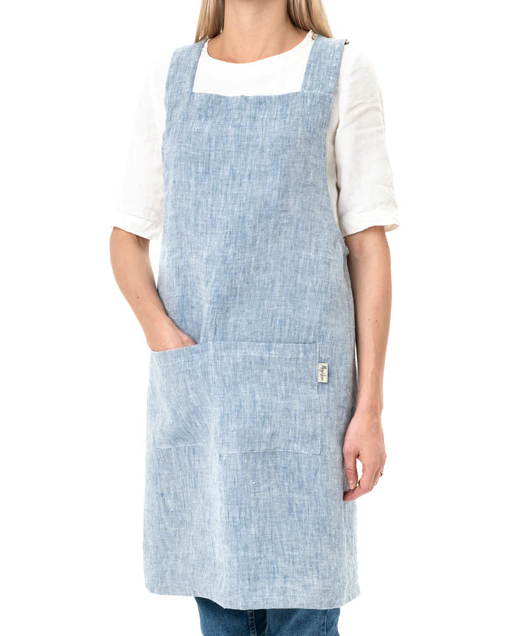 MagicLinen Pinafore Cross-Back Linen Apron in Dusty Blue, L-XL, featuring criss-cross straps and side pockets, ideal for cooking or gardening.