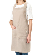 MagicLinen Pinafore Cross-Back Linen Apron in L-XL, featuring a stylish design with criss-cross straps and side pockets, perfect for cooking or gardening.