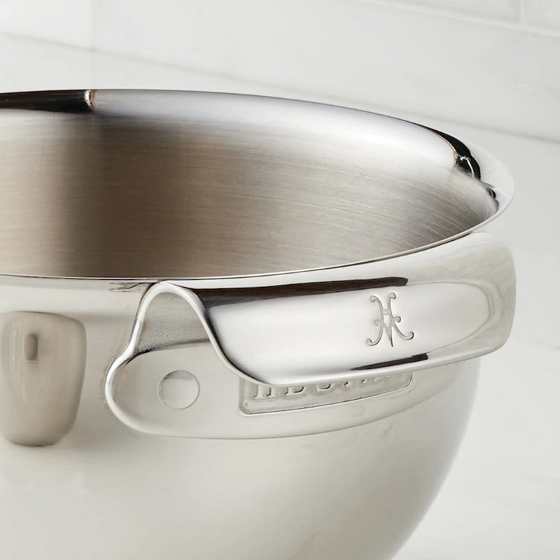 Hestan Provisions | 7qt Stainless Steel Mixing Bowl with flared rim, side handle, and pouring spout on a light countertop, showcasing premium craftsmanship for versatile cooking.