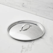 Hestan Provisions | Stainless Steel Lids Large, 12.5 shown on a marble countertop, featuring a raised handle for secure grip and durable tri-ply stainless-steel construction.