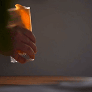 Richard Brendon | Diamond Highball glass held in a hand, showcasing its intricate diamond pattern design, perfect for enhancing any cocktail experience.