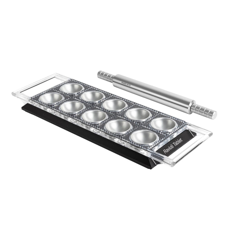 Marcato Ravioli Tablet - Powder Pink: Includes a rectangular pasta mold with circular cavities and a branded stainless-steel rolling pin for making ten square ravioli effortlessly.