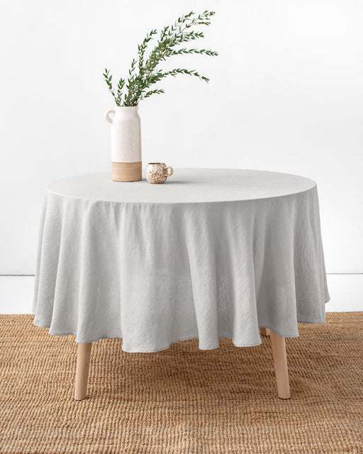 MagicLinen Round Linen Tablecloth, 79 inches, enhances dining with its elegant drape, perfect for sophisticated table settings at Athens Cooks kitchen store.