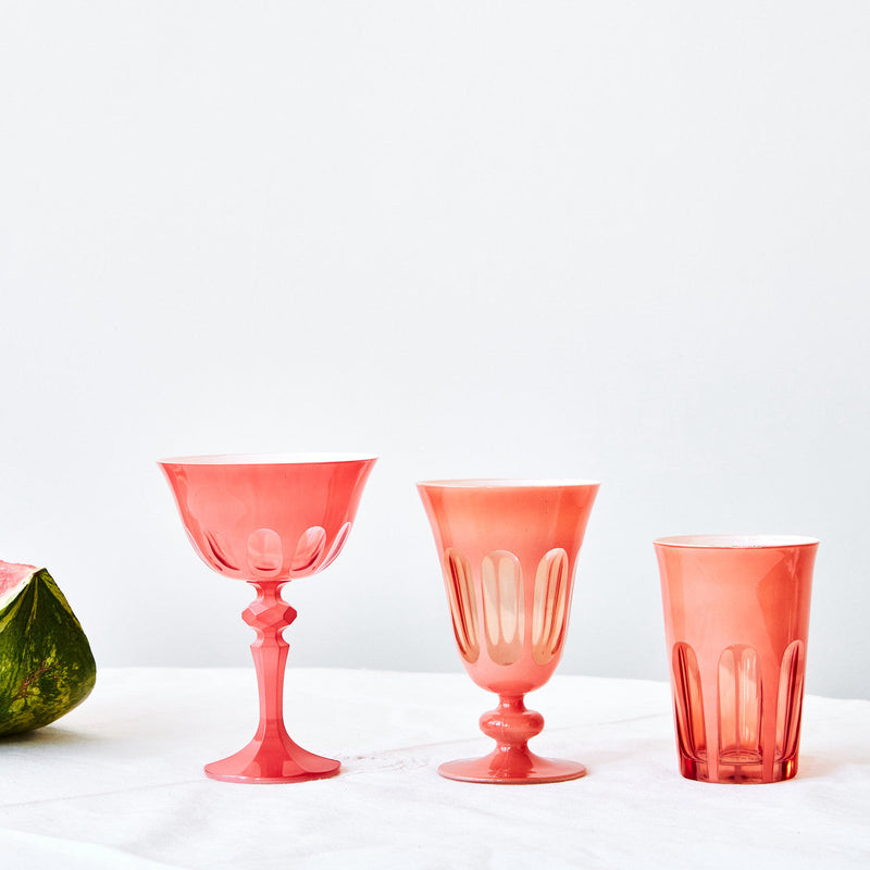 Sir|Madam Rialto Salmon glassware styled on a linen-draped table with fresh watermelon