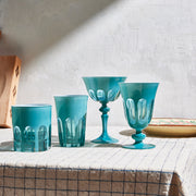 Sir|Madam Rialto Teal glassware collection styled on a checked tablecloth in warm daylight