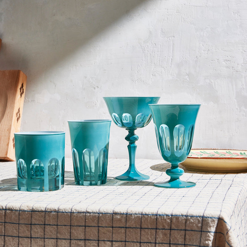 Sir|Madam Rialto Teal glassware collection styled on a checked tablecloth in warm daylight