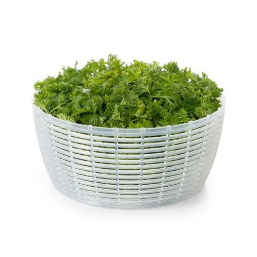 OXO Good Grips Salad Spinner with non-slip knob and base, features a spinning basket for easy rinsing and drying of greens. Ideal for compact kitchen storage.