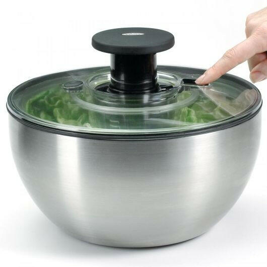OXO Good Grips Salad Spinner with non-slip knob and brake button, functions as a colander for rinsing; ideal for drying and serving greens, featured at Athens Cooks.