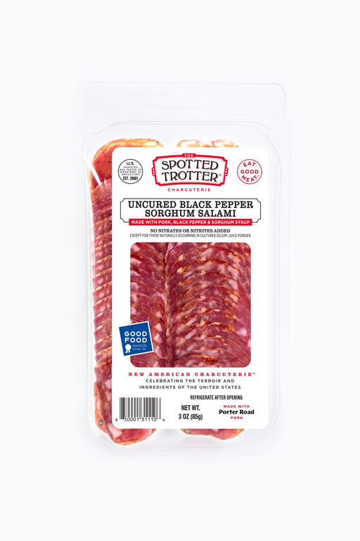 Spotted Trotter | Salamis - Black Pepper Sorghum, artisanal salami with visible marbling and spices, crafted from high-quality pork, embodying traditional Spanish flavors.