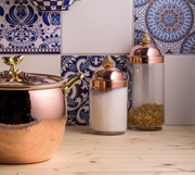 Ruffoni | Kitchen Jars - Large, featuring a tall glass jar with a copper lid and artichoke-shaped bronze knob, ideal for storing pasta or grains.
