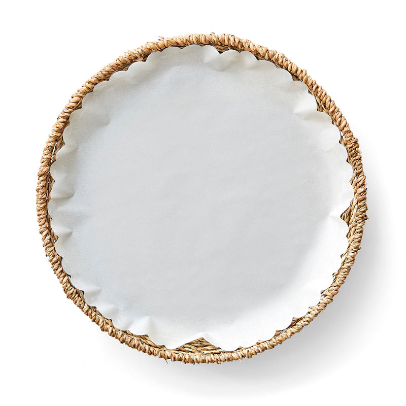 Wicker basket containing Classic White Original Flat Plate Liners, ideal for protecting and showcasing your fine dishes, available at Athens Cooks.