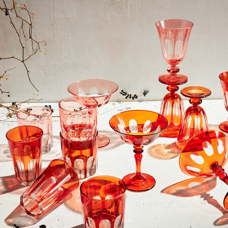 Sir|Madam | Rialto Old Fashion Light Red Set of 2, showcasing artisan-crafted, uniquely colored glassware inspired by Venice's arches, displayed with berry-accented branches.