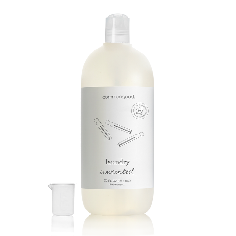 Common Good | Laundry Detergent Bottle, 32 Fl Oz, shown with a measuring cup. Concentrated for 48 loads, plant-based, unscented, gentle on fabrics.