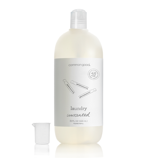 Common Good | Laundry Detergent Bottle, 32 Fl Oz, shown with a measuring cup. Concentrated for 48 loads, plant-based, unscented, gentle on fabrics.