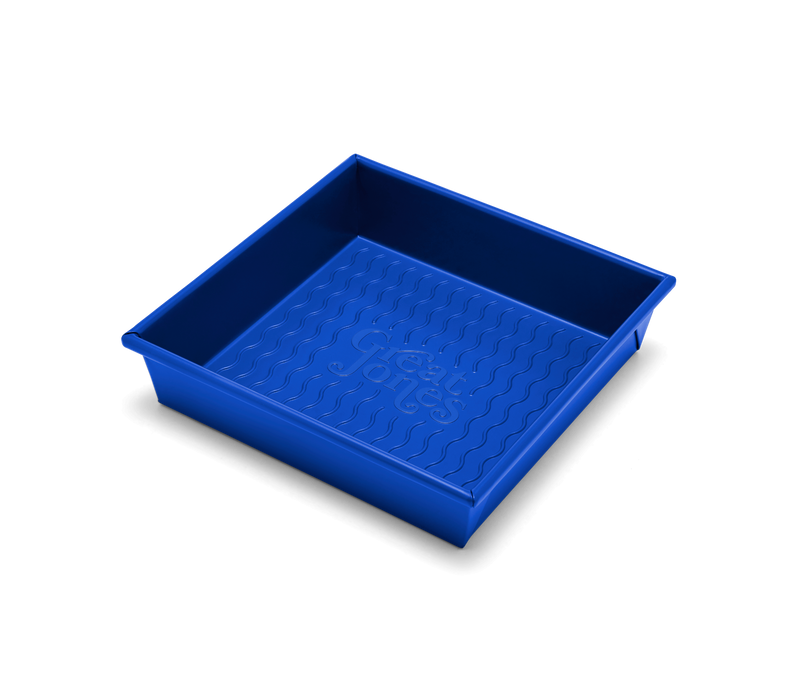 Great Jones | Square One - Blueberry: A 9x9-inch square baking pan with a wavy, corrugated bottom for easy release and nonstick, nontoxic coating.