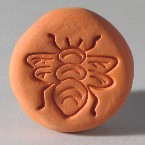 Clay-carved bee on Sugar Saver - Maple Leaf, a terracotta tool from Athens Cooks to keep brown sugar soft.