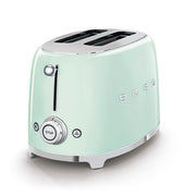 Smeg | Toaster - Pastel Green: Retro-style two-slice toaster with chrome controls, offering 6 toasting levels, defrost, reheat, and bagel functions, plus an easy-clean crumb tray.