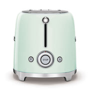 Smeg | Toaster - Pastel Green, featuring two slots, six toasting levels, chrome accents, and defrost, reheat, and bagel functions, ideal for compact kitchen spaces.