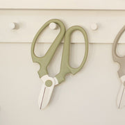 The Floral Society | Japanese Floral Clippers, Citrine with olive-green handles on a white peg, ideal for precise flower and garden trimming, made in Japan.